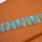 Textil des Edelweiß Alpaka Schals in Farbe dunkelorange