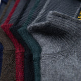 Farbpalette des Alpaka Troyers von Alpakin aus Naturfarben und männlich-eleganten Farben wie dunkelblau und dunkelgrün